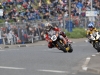 John McGuinness leads Keith Amor at Church Corner NW200