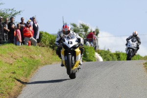 Adrian Archibald in front of the late Andrew Neil skerries 100