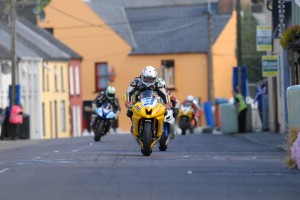 Dean Harrison leads David Yeomans and Alan Bonner through the narrow streets of Dunmanway at the 2010 Munster 100